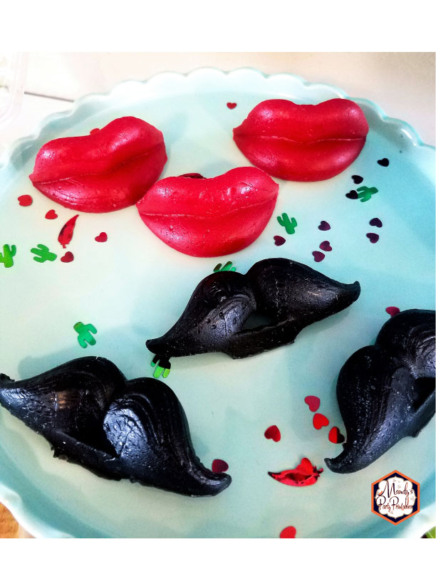 Wax lips and mustache's from a Taco Bout Love Valentine Taco Party | Mandy's Party Printables #valentineparty #tacoparty #tacoboutlove #ilovetacos #MPP #fiesta